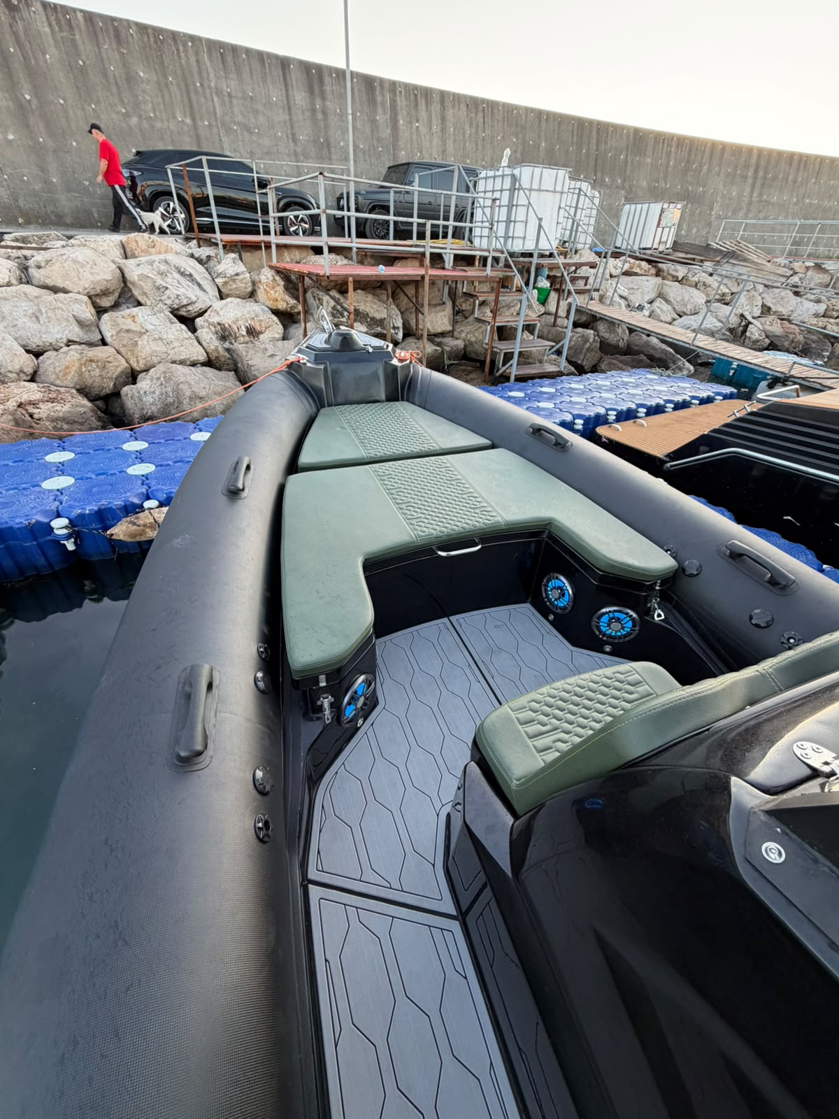 Bow sunbed and seating with hex-stitched green cushions
